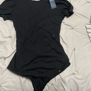 Crossed back body suit